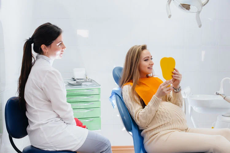 dentist examining pregnant woman 